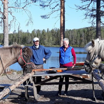 Anne and Jukka welcome visitors who came by horse powers